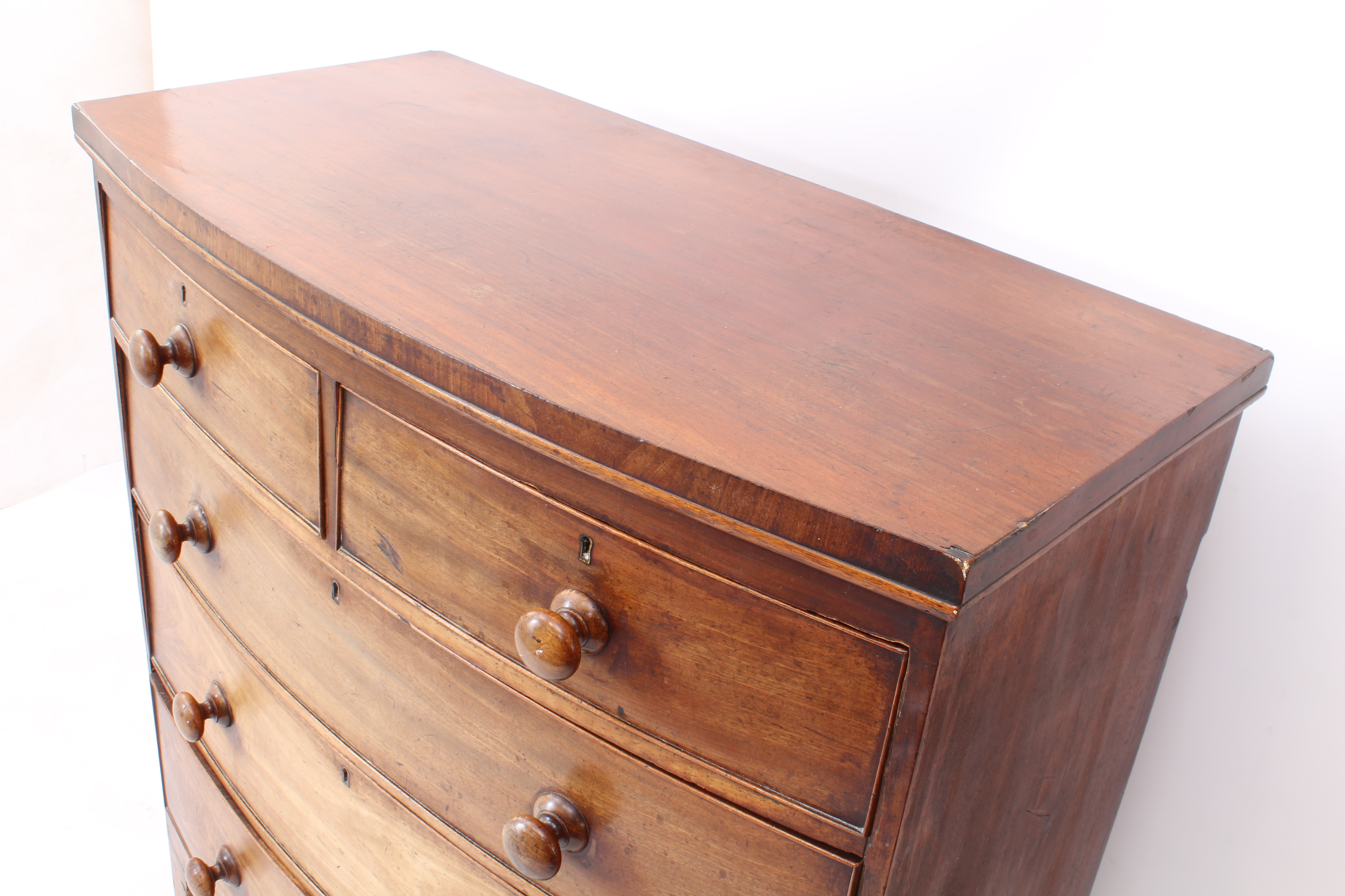 A mid-19th century mahogany bowfront chest of drawers - with two short over three long graduated - Image 4 of 4