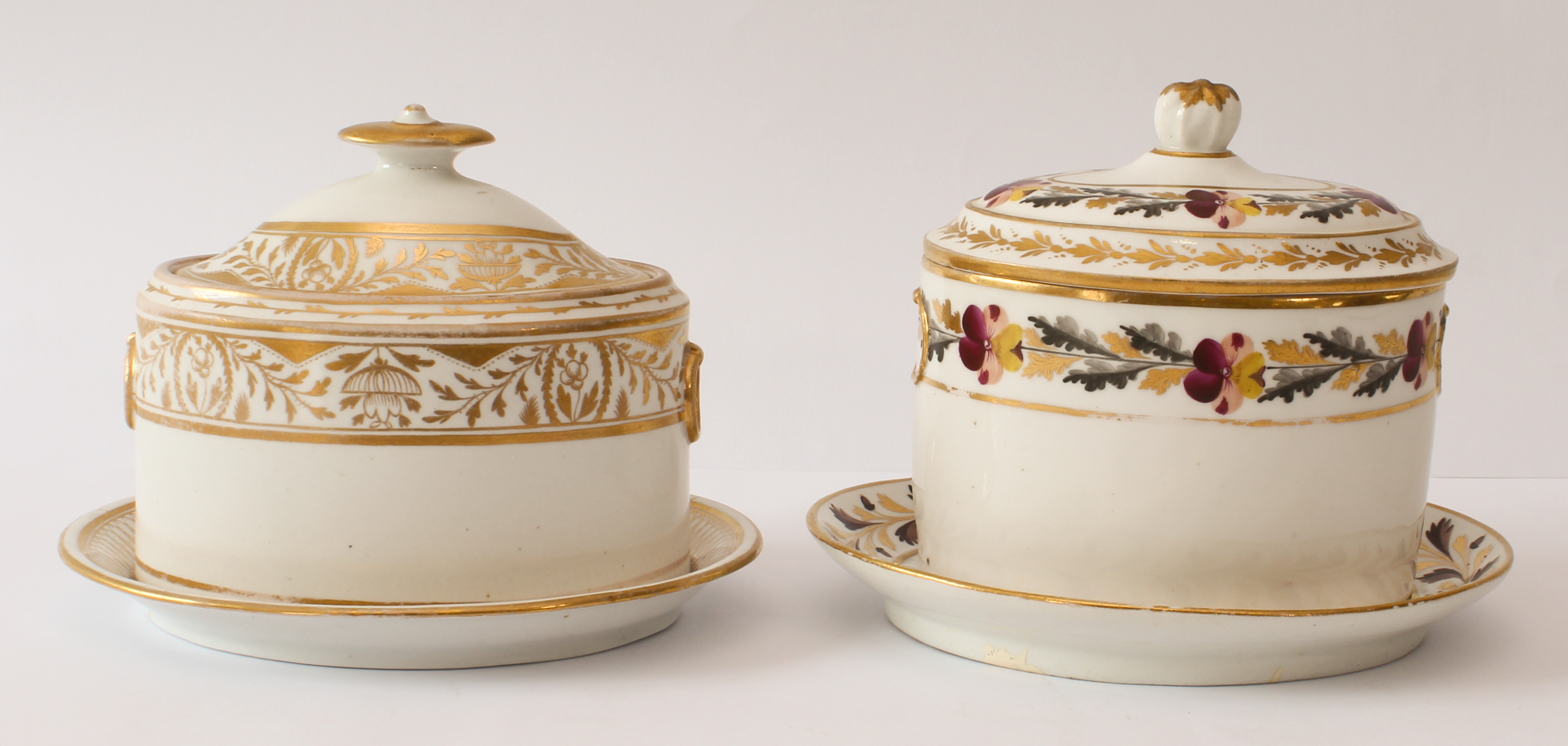 Two 19th century English porcelain oval sugar boxes and closely matched stands - one decorated