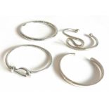 Four sterling silver bangles - each stamped 925, one Birmingham hallmarked.