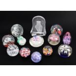 A collection of thirteen glass paperweights - late 20th century, including a Caithness 'Mooncrystal'