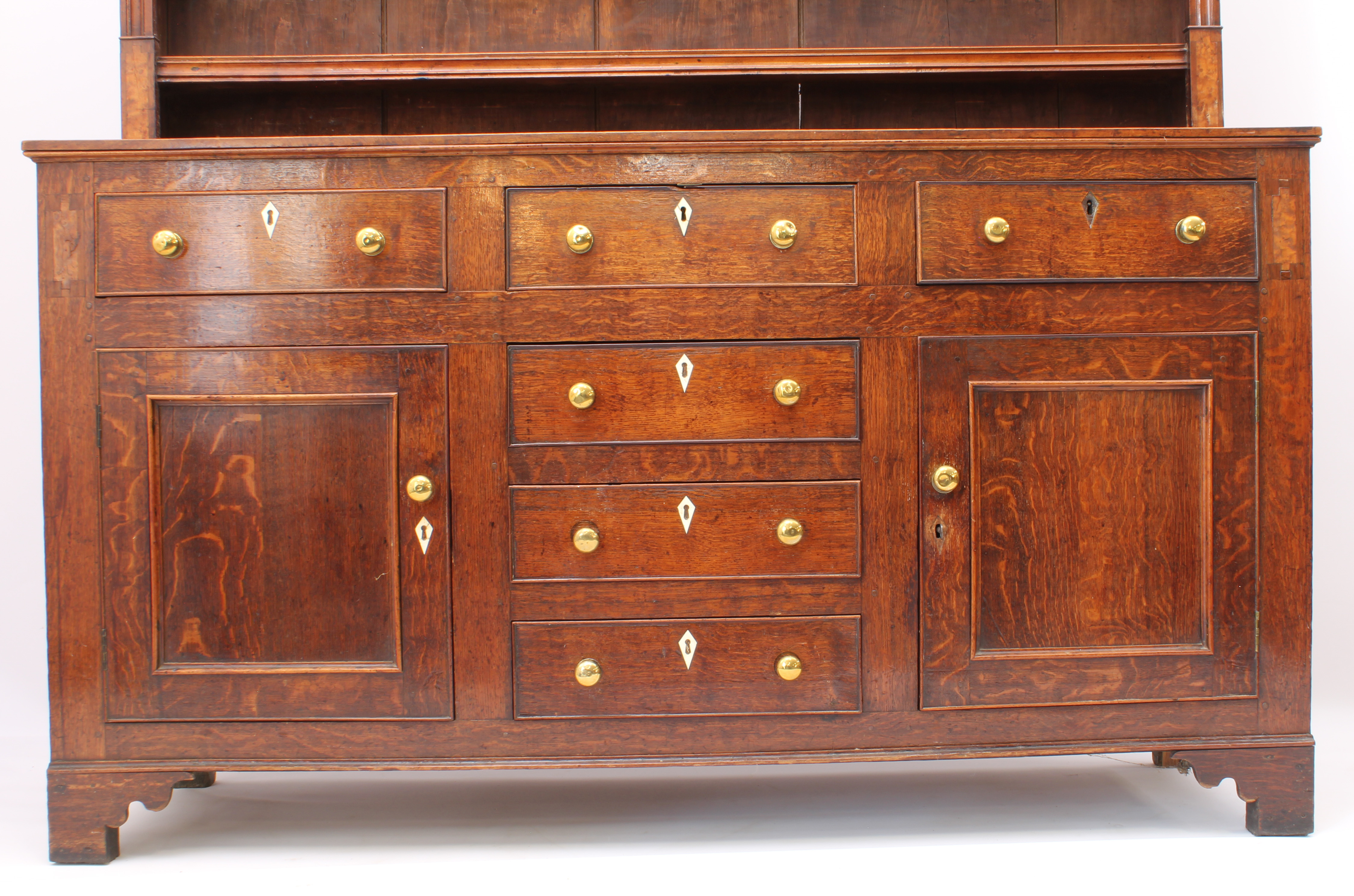 A George III oak, fruitwood and birds' eye maple inlaid dresser - the cavetto cornice over a - Image 6 of 7