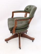 A green buttoned leather swivel captain's-style desk chair - raised on five moulded, swept legs with