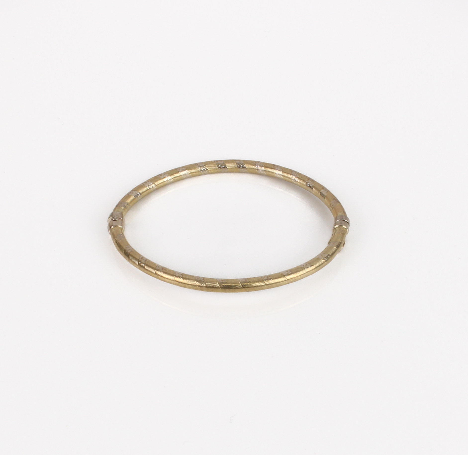 An Italian 9ct two-colour gold hinged bangle - marked 'Italy 9Kt', internal size 6.1 x 5.1 cm. - Image 3 of 3