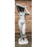A moulded stone garden statue of a female with elbow aloft - 113cm high.
