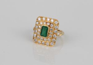 A French 18ct gold, emerald and diamond cluster ring - with French eagle's head mark, the 6.5 x 4.