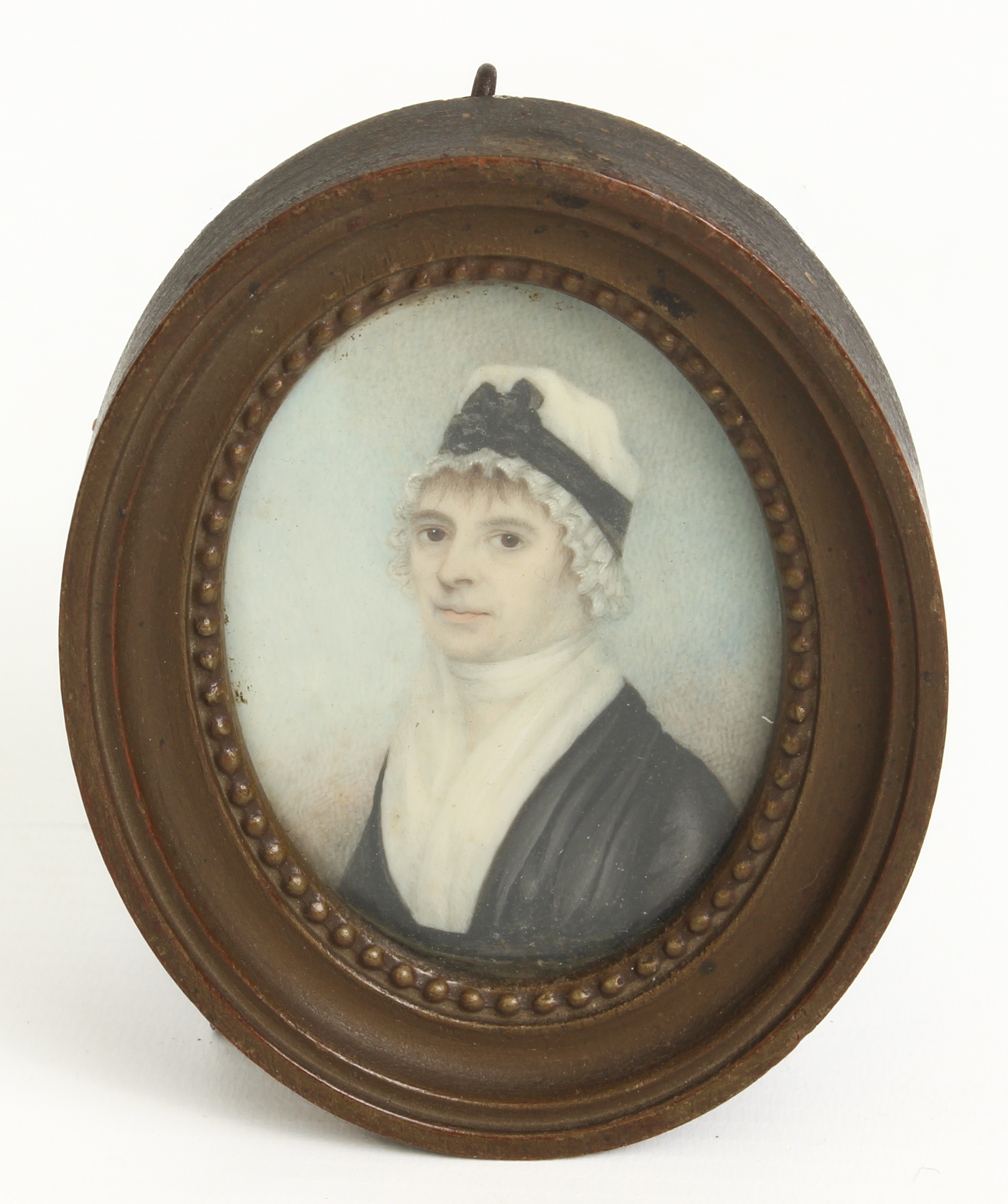 A 19th century portrait miniature on ivory of a lady, oval frame and glazed, plated hair and bow