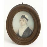 A 19th century portrait miniature on ivory of a lady, oval frame and glazed, plated hair and bow