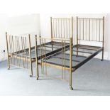 A pair of brass single beds by Heal & Sons (Heals) - 1920s-30s, the head and foot boards with square