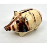 A slipware glazed pig money bank - late 19th / early 20th century, 10 cm long,