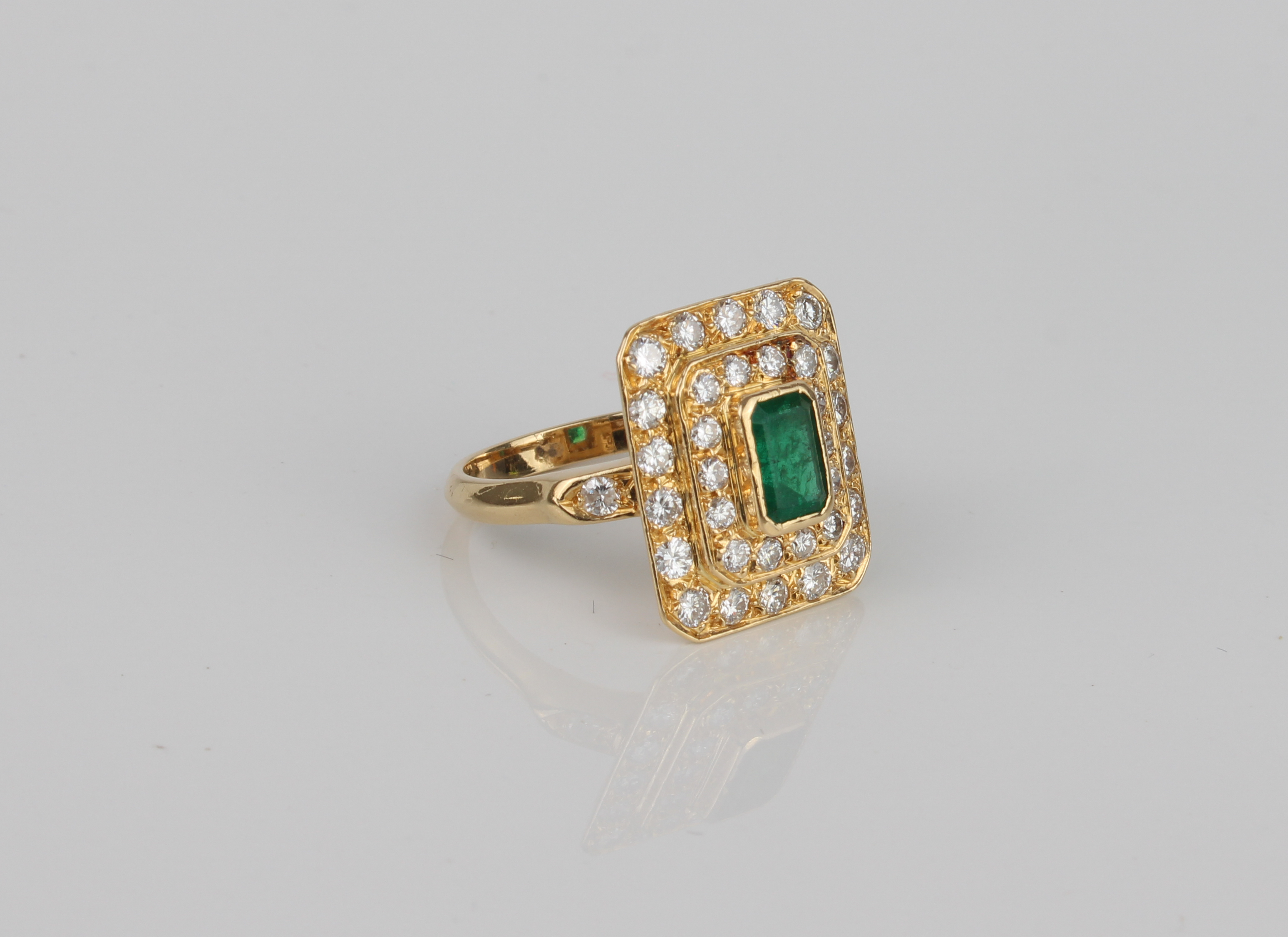 A French 18ct gold, emerald and diamond cluster ring - with French eagle's head mark, the 6.5 x 4. - Image 2 of 4