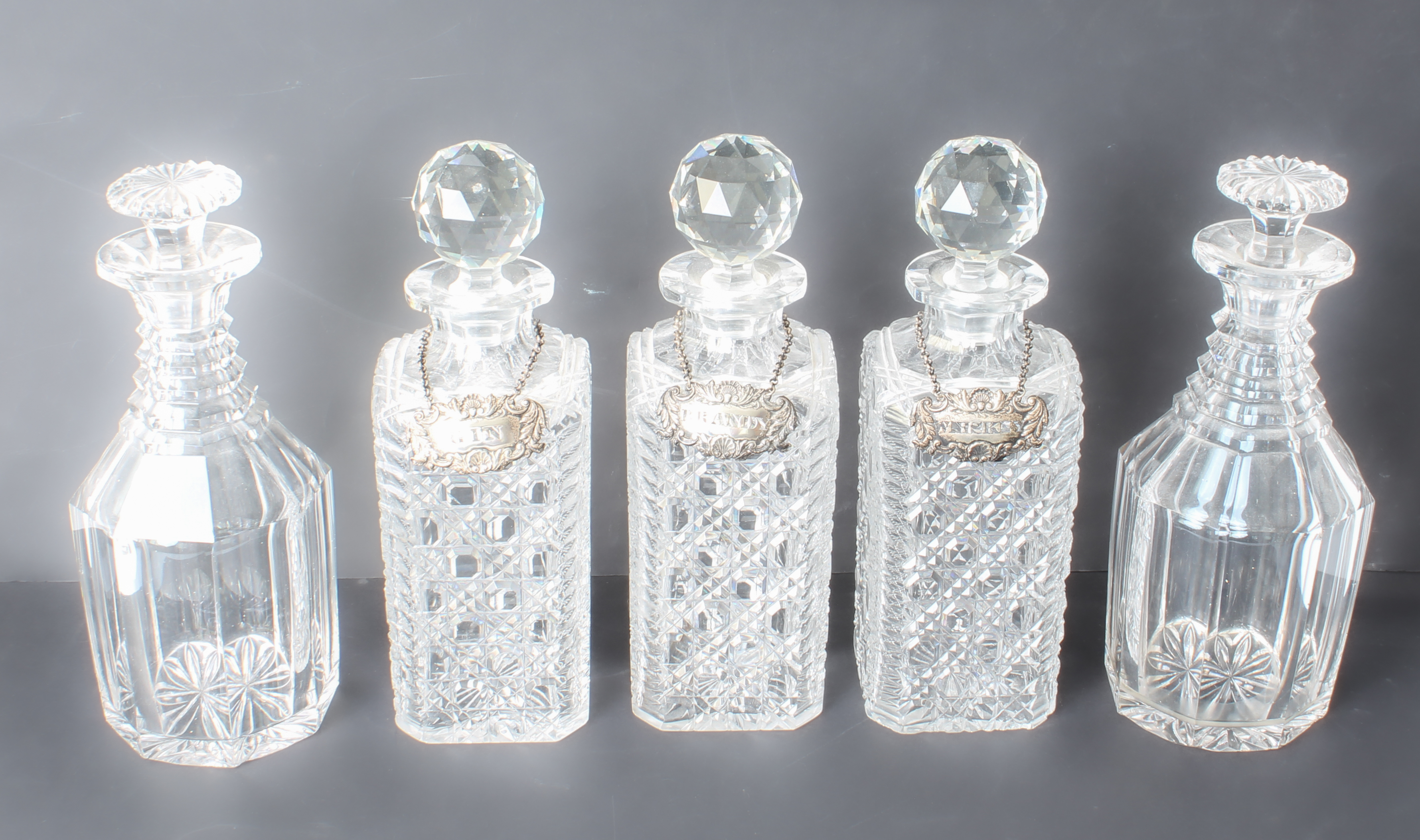 Seven cut glass decanters - a trio of early 20th century square hobnail cut tantalus decanters - Image 5 of 5