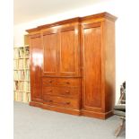 A good quality mid-19th century mahogany breakfront compactum wardrobe - the cavetto cornice over