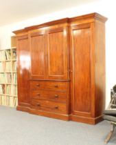 A good quality mid-19th century mahogany breakfront compactum wardrobe - the cavetto cornice over
