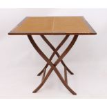 An Edwardian mahogany folding whist table - the square, centre hinged top with (faded) green