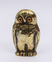 A novelty Owl match holder - with glass eyes, 10 cm high.