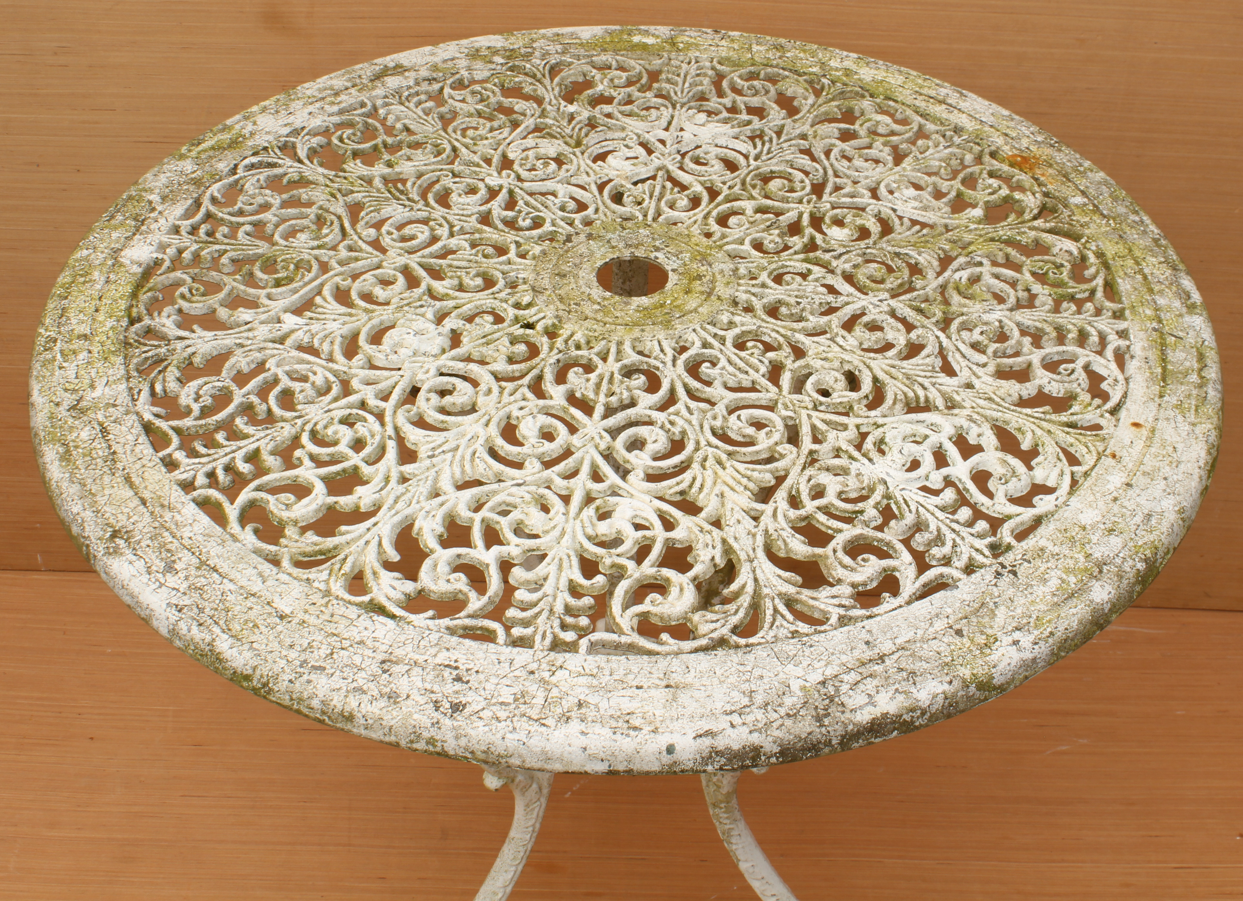 A cast metal garden table - circular, with pierced foliate scroll decoration, on three swept - Image 2 of 2