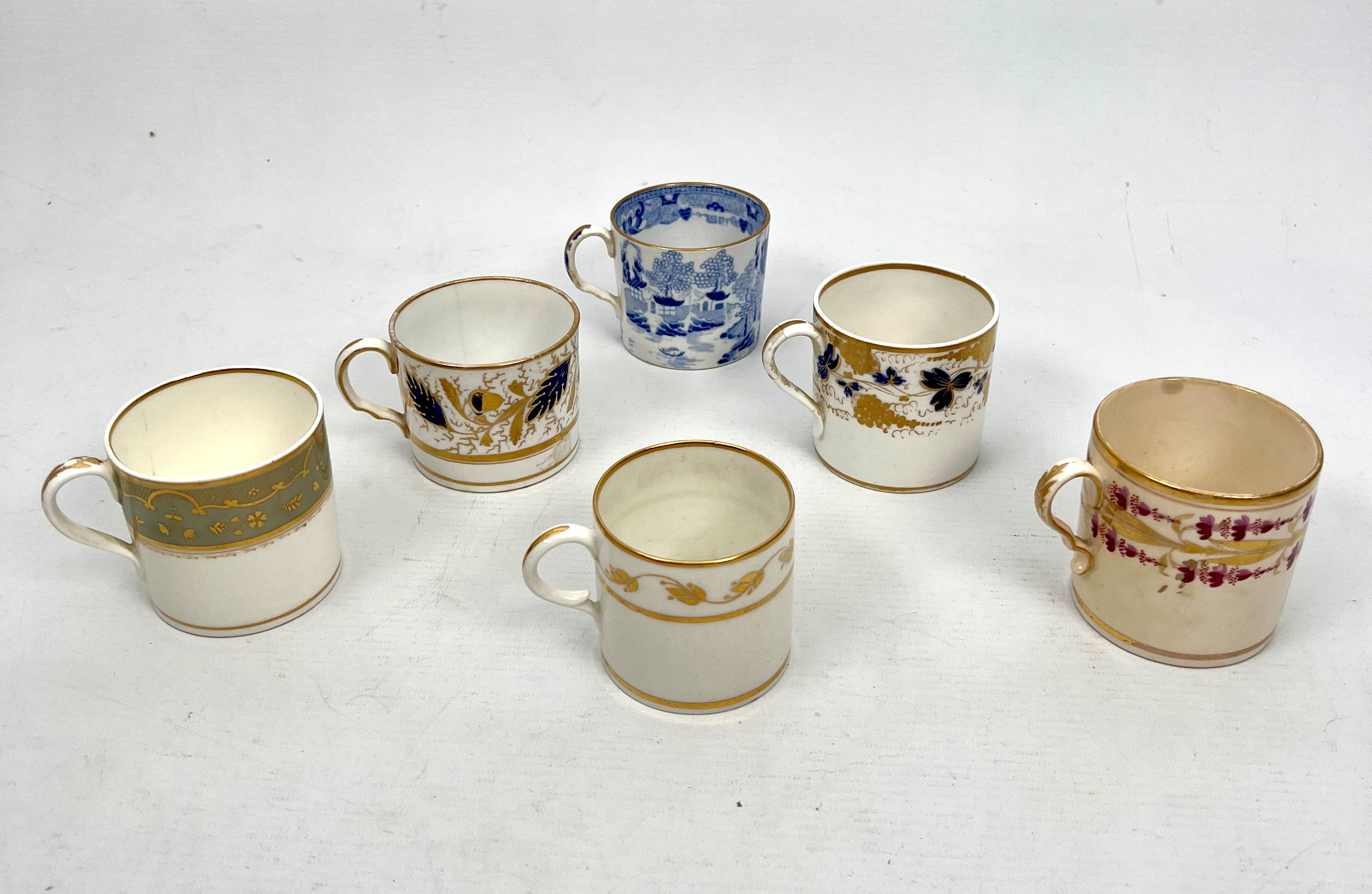 Six late 18th and 19th century English porcelain coffee cans - including three examples by Derby and