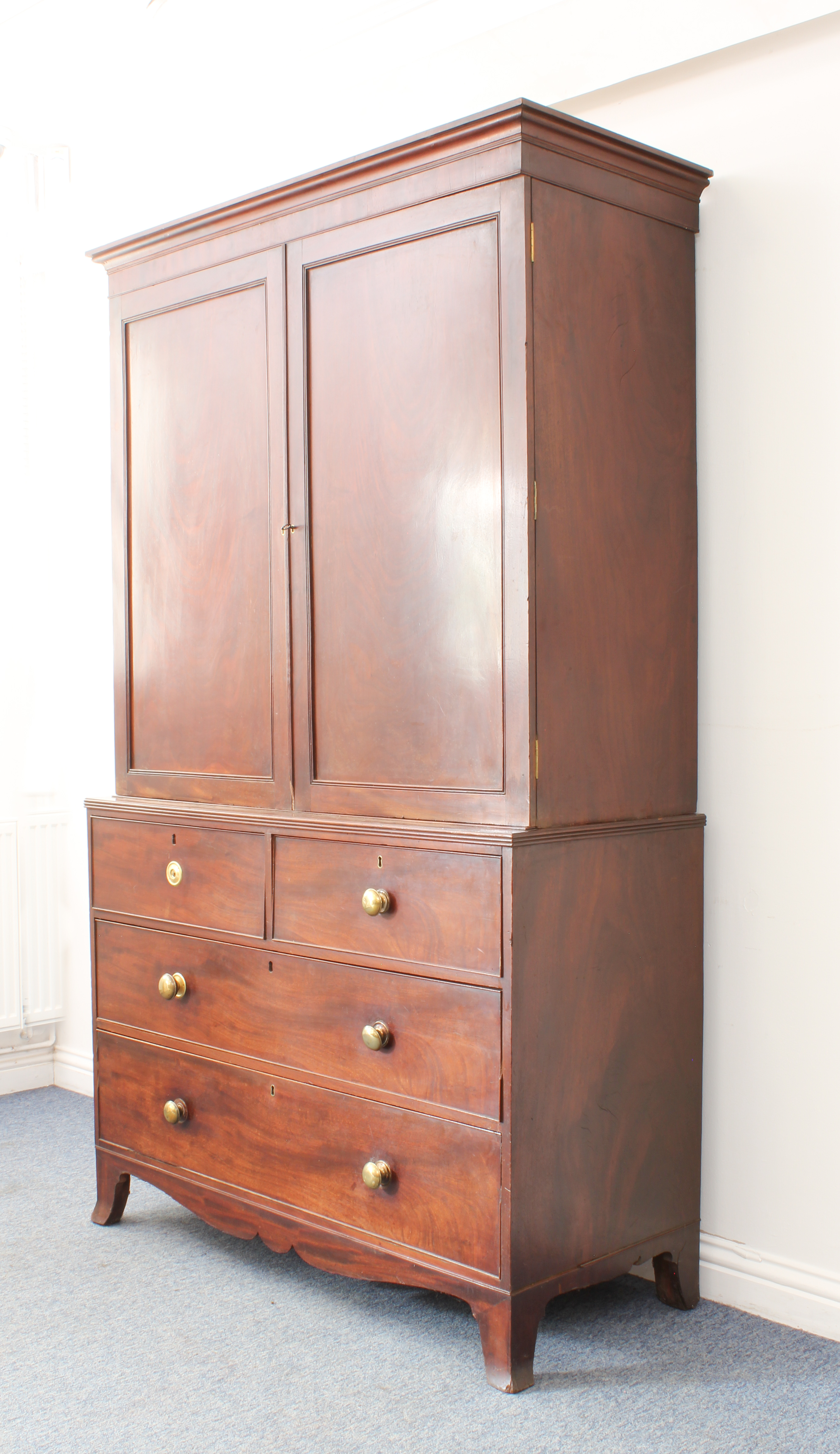 An early 19th century mahogany linen press - the moulded cornice over a pair of panelled doors, - Image 2 of 5