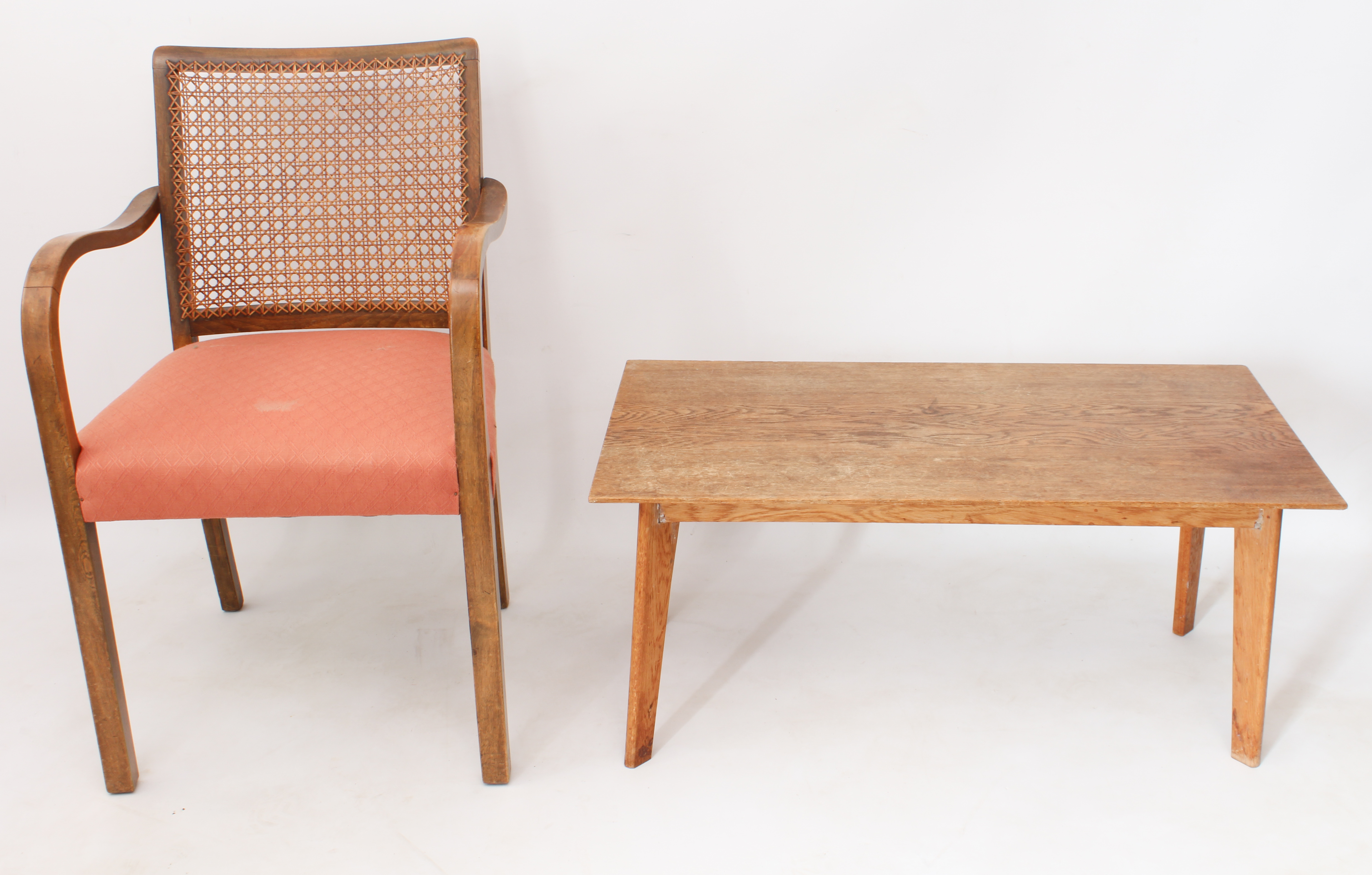 A mid-century armchair and coffee table - comprising a 1930s-50s bentwood beech and cane armchair,