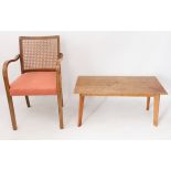 A mid-century armchair and coffee table - comprising a 1930s-50s bentwood beech and cane armchair,