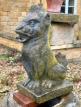 A composite stone garden water feature statue in the form of a mythical lion - 43cm high.