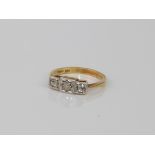 A mid-century style 18ct yellow gold and diamond three stone ring - hallmarked Birmingham 1985, with