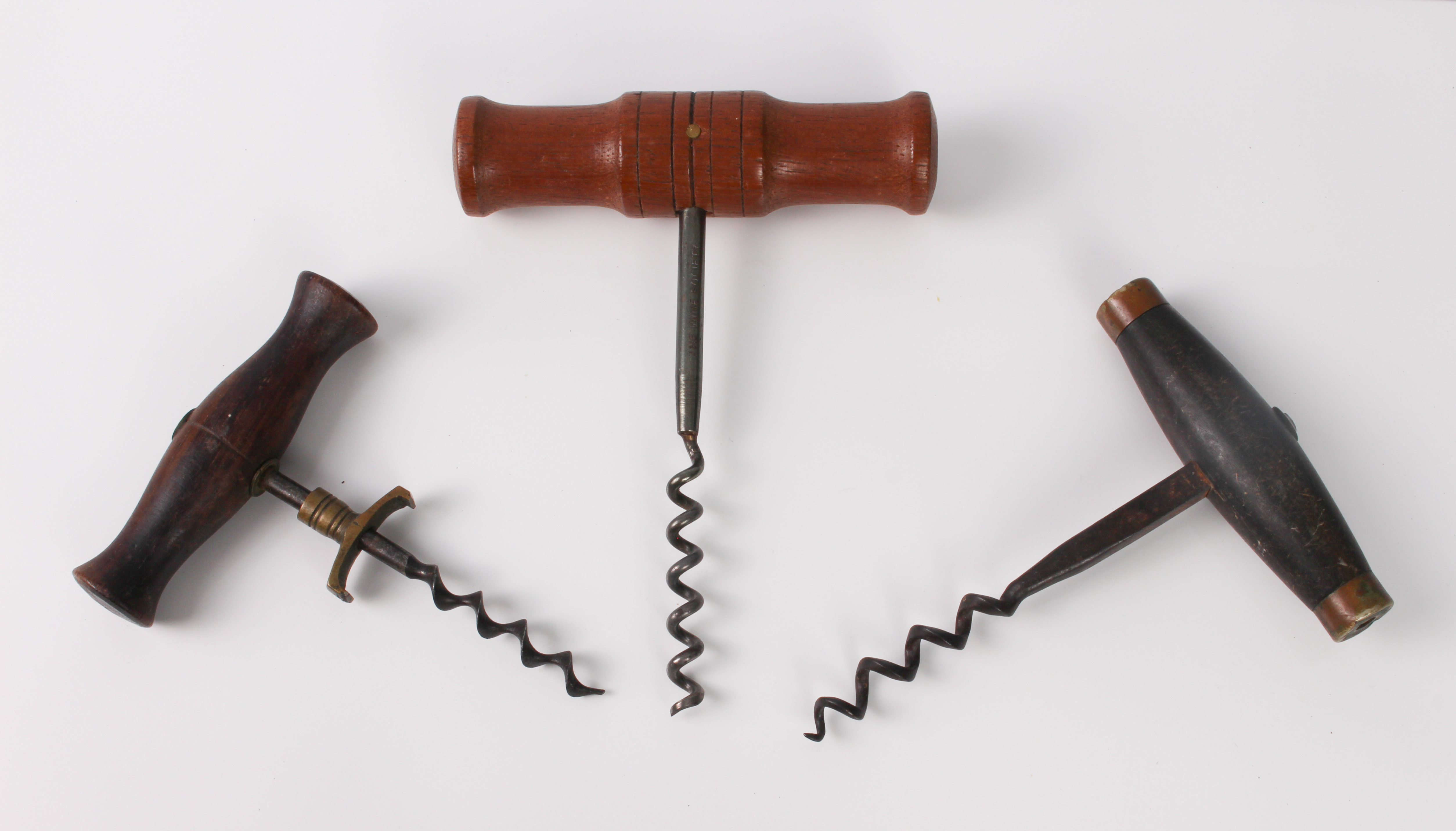 Two antique corkscrews - one with turned rosewood handle, brass collar and speed worm helix, 11.4 cm