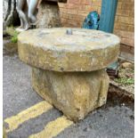 A water feature base - with a circular grinding stone and on a shaped base. Base: 50cmW x 31cmD x