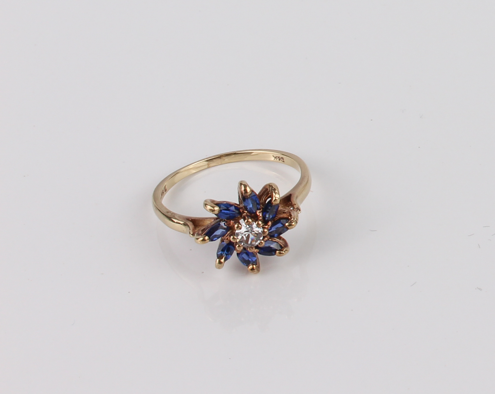 A vintage 9ct yellow gold, blue and white sapphire floral cluster ring - hallmarked London 1970, the