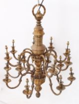 An impressive early 20th century sixteen-light gilt two-tier brass chandelier - the sixteen