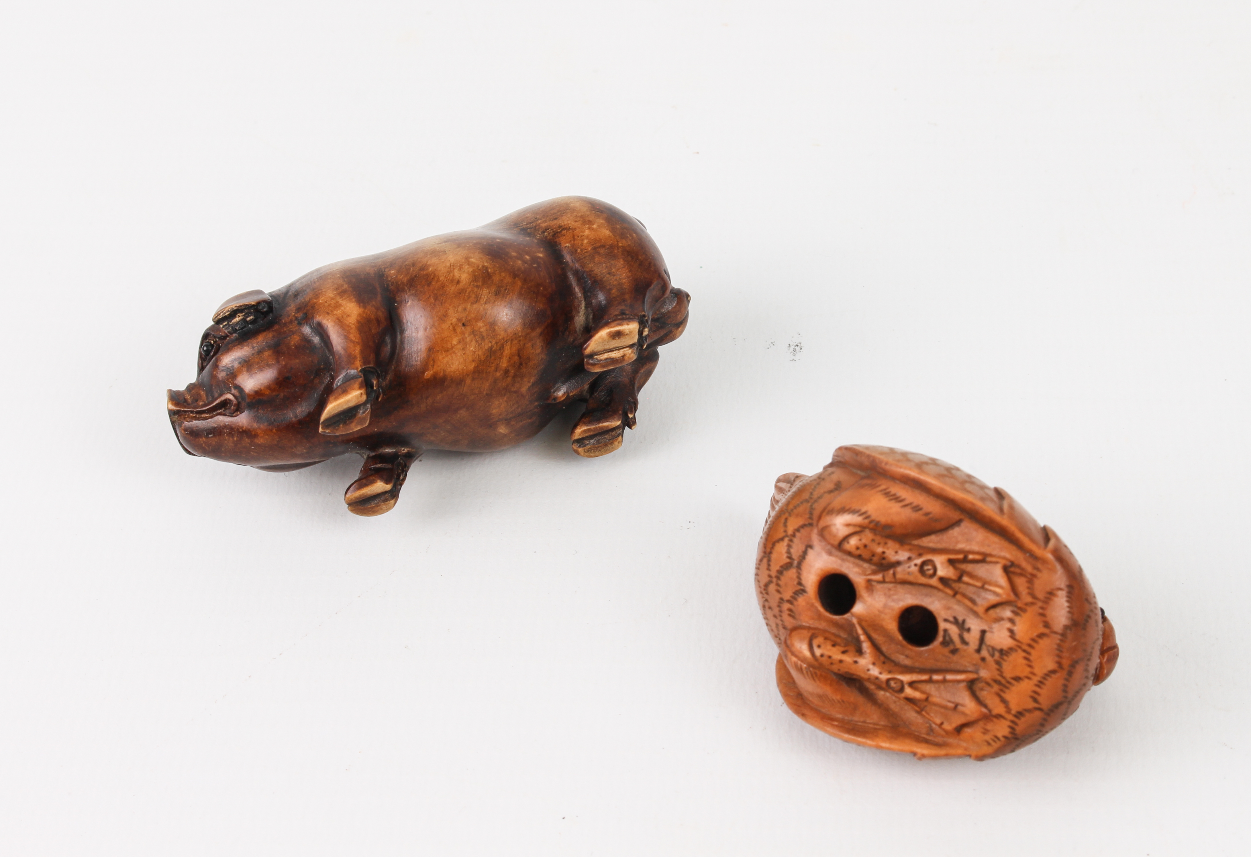 A carved fruitwood Okimono of a pig, plus a carved and signed netsuke of a Mandarin duck. - Image 3 of 3