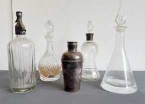 Three decanters and a soda syphon: 1.cut glass with silver mount, thistle-shaped, Mappin & Webb,