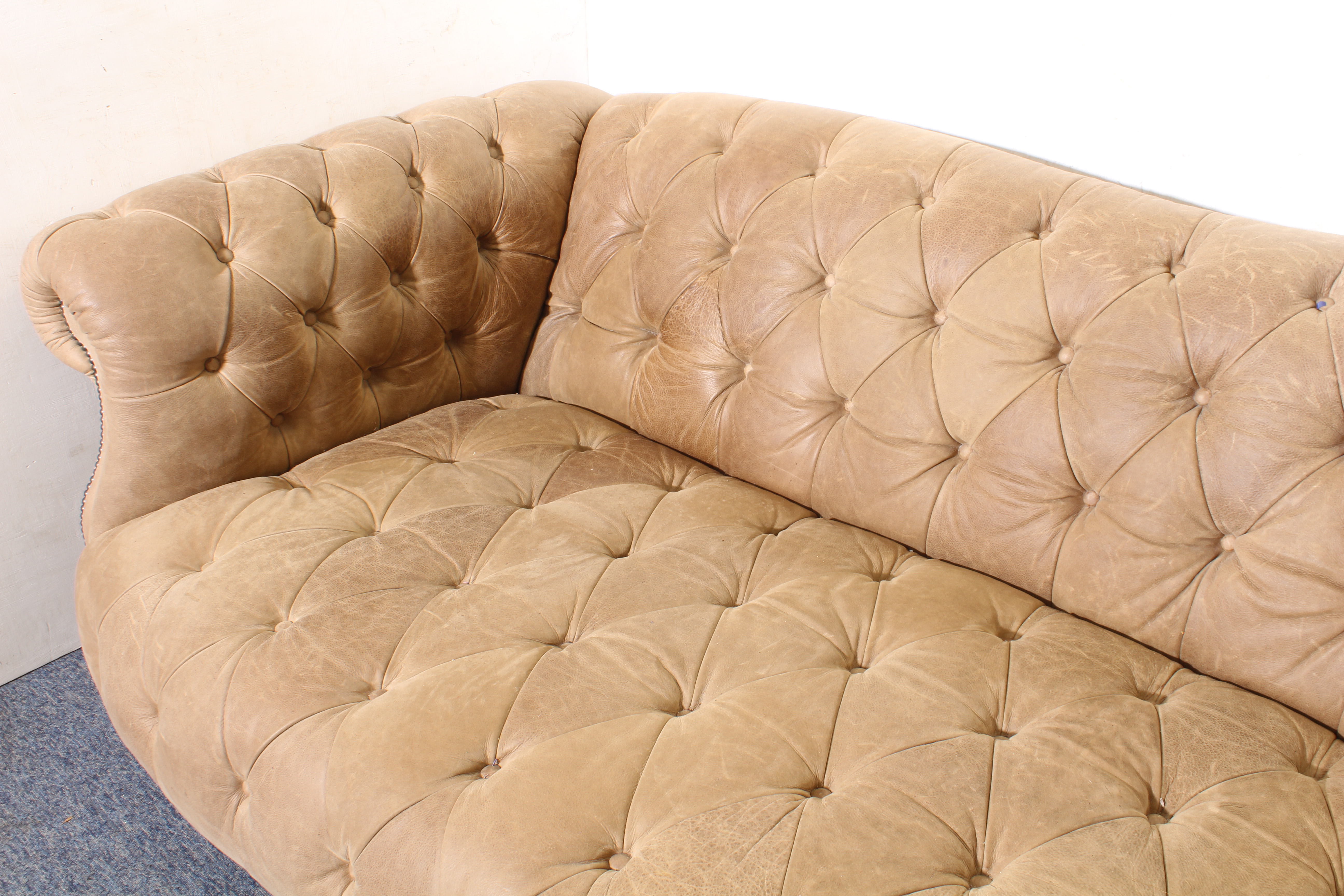 A leather Chesterfield three-seater sofa - modern, in soft pale-brown grained leather, raised on - Image 4 of 4