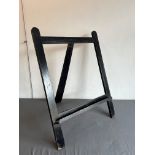 A small ebonised oak artist's or picture easel - early 20th century, 71 cm wide, 52 cm high.