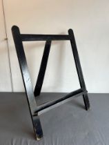 A small ebonised oak artist's or picture easel - early 20th century, 71 cm wide, 52 cm high.