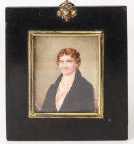 A 19th century portrait miniature of a gentleman on ivory within a square black frame and glazed.