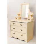 An Edwardian painted dressing table - the back with rectangular plate with pierced cresting, above