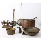 Seven pieces of copper and brass ware: a large copper and wrought iron 30 cm sauce pan; a smaller