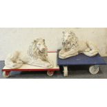 A pair of recumbent garden lion sculptures - cast cement, modern, 64 cm long.