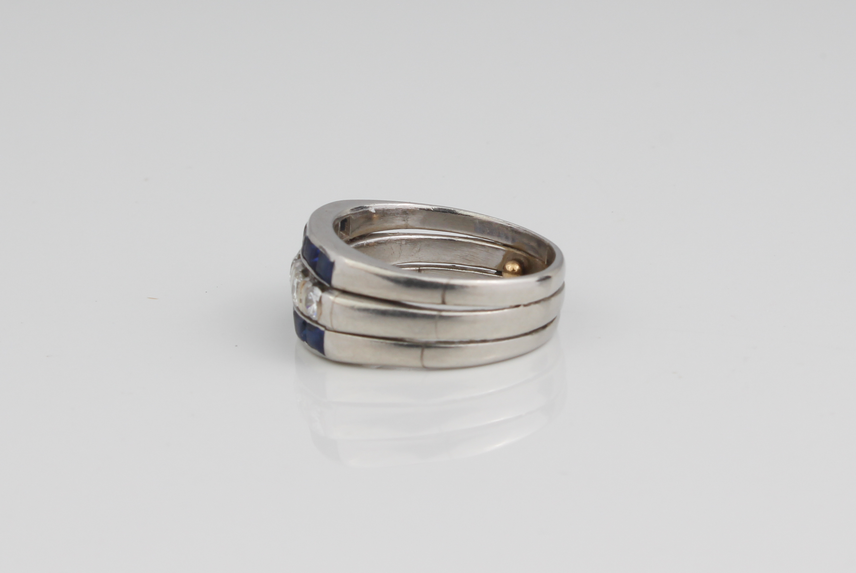 A platinum, sapphire and diamond three-row ring - unmarked, tested as platinum, the central row of - Image 3 of 4