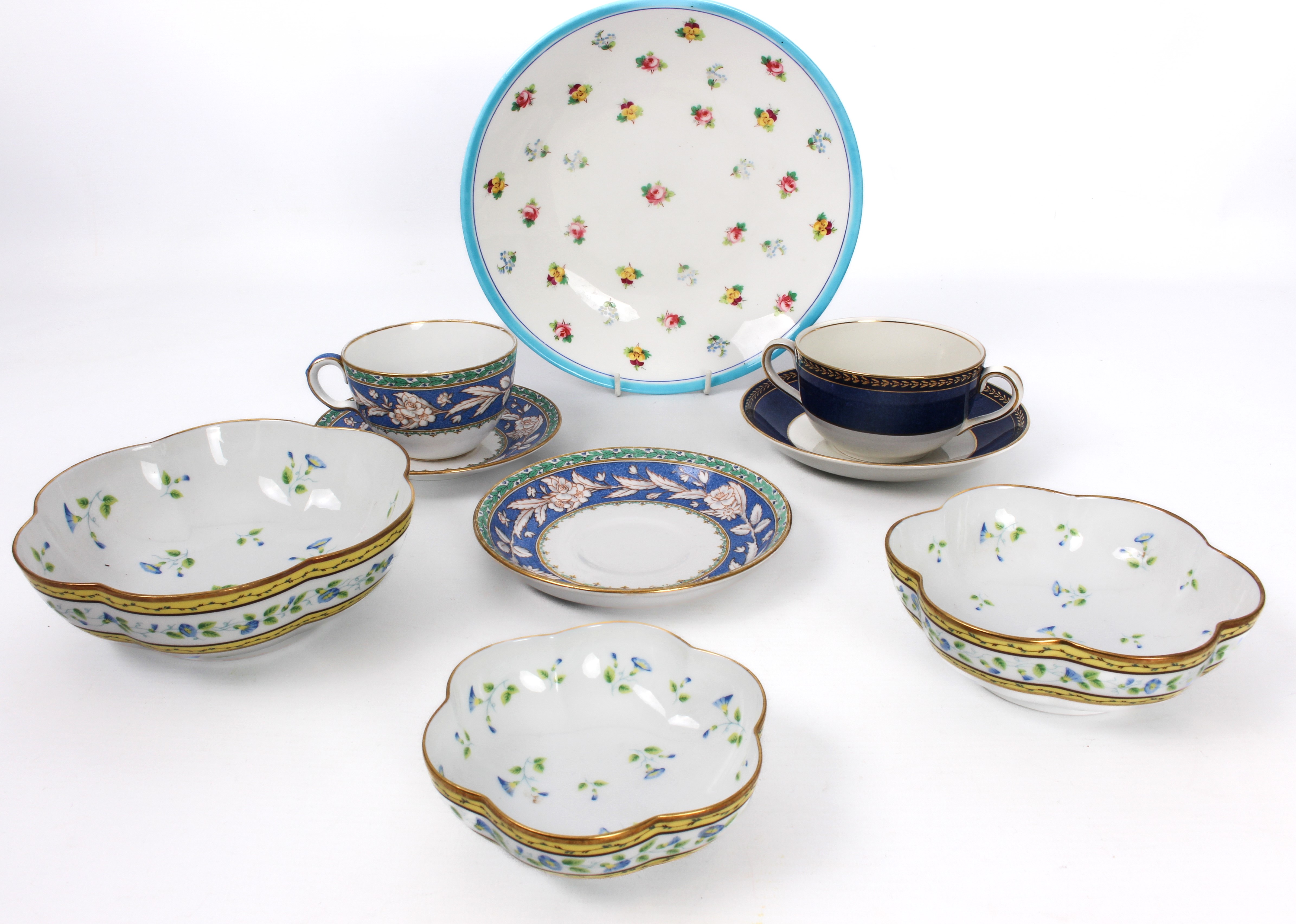 A small group of bone china and porcelain - comprising a graduated set of three A. Reynaud et Cie