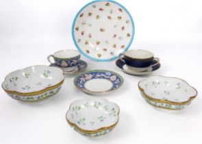 A small group of bone china and porcelain - comprising a graduated set of three A. Reynaud et Cie