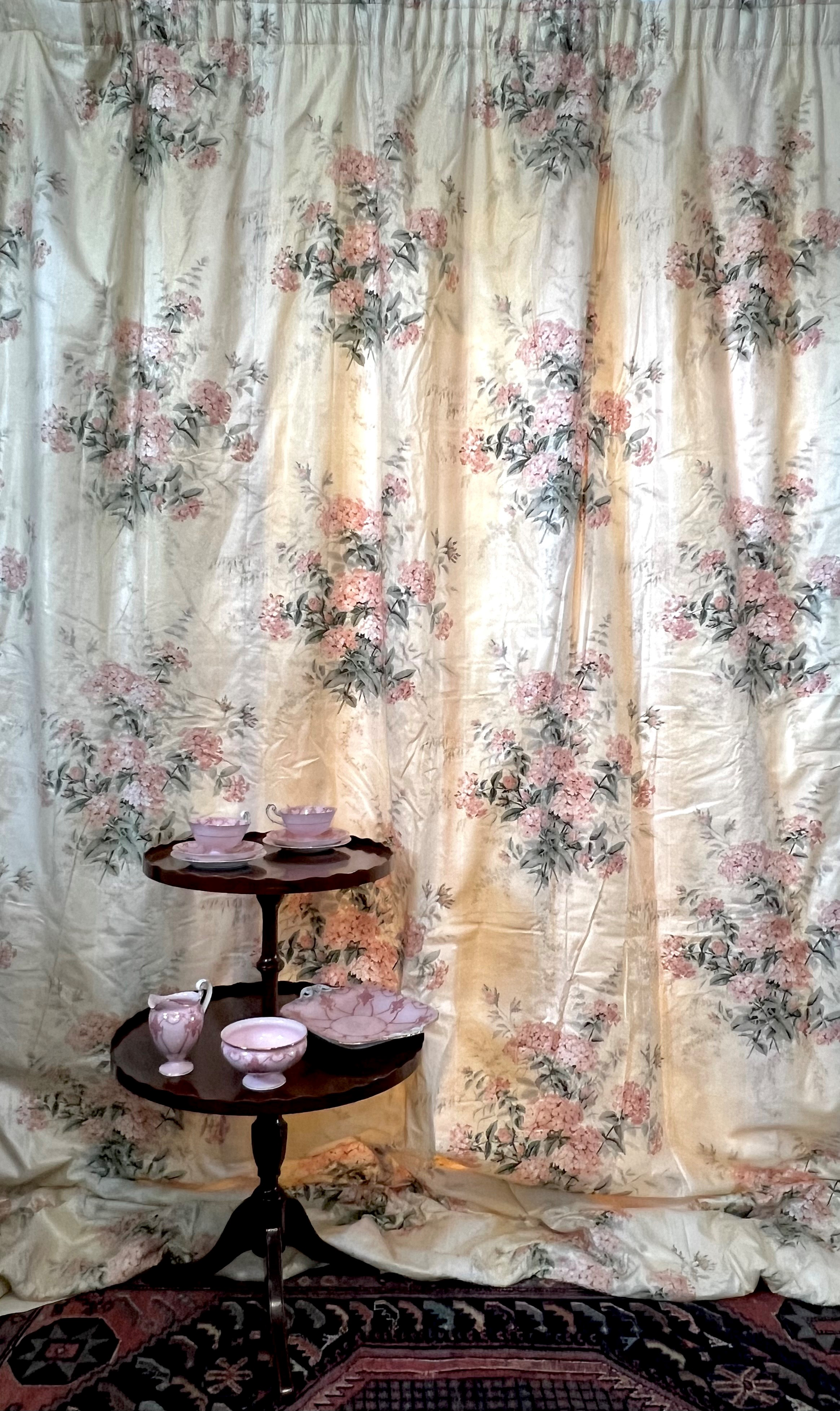 A pair of handmade curtains in ‘Plumbago Bouquet’ cotton chintz by Colefax and Fowler, together with