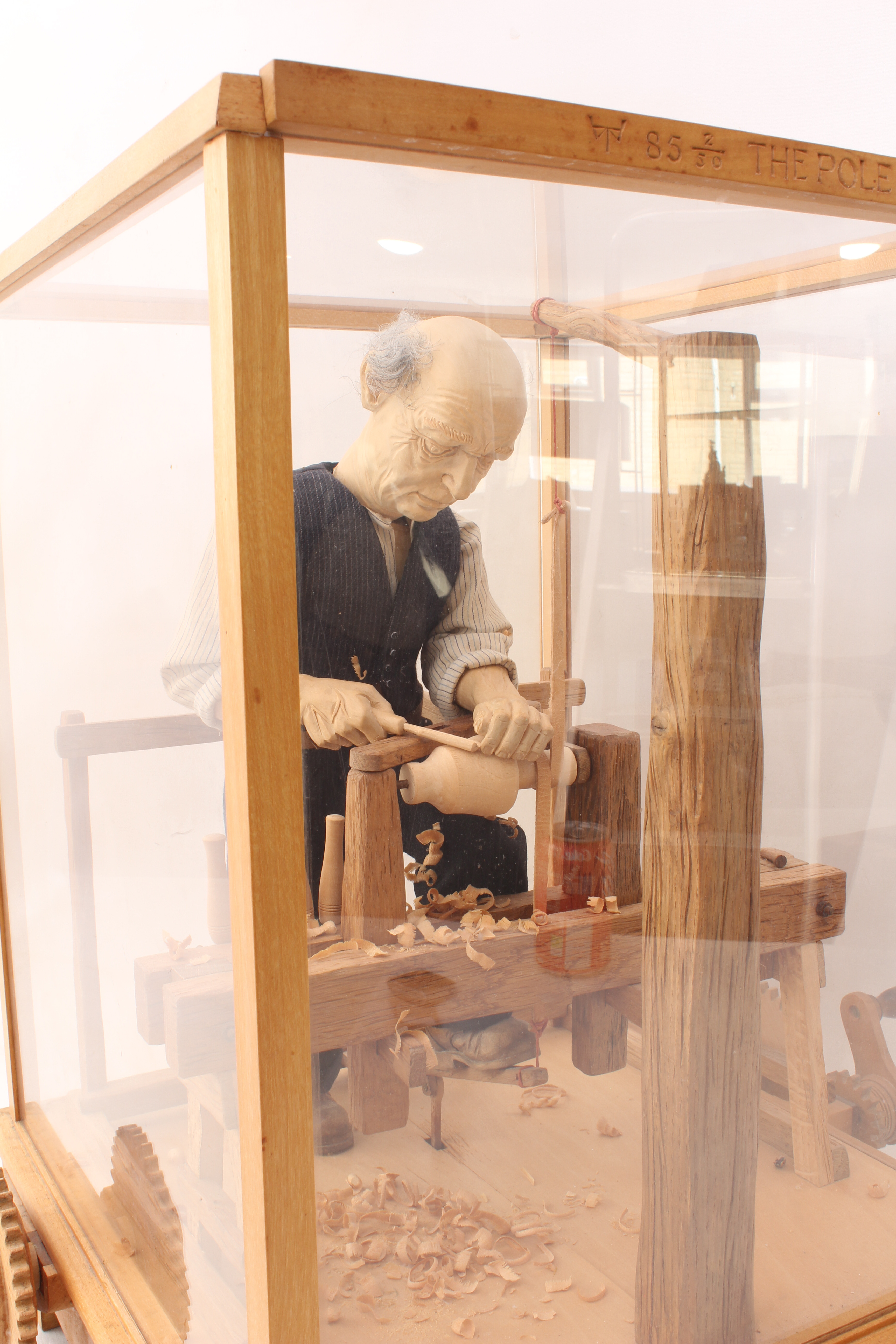 A fine carved wooden automaton of a woodworker, 'The Pole Lathe' - late 20th century, the carved - Image 5 of 6
