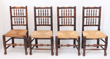 A matched set of four beech and oak spindle-back dining chairs 18th century style - early 20th