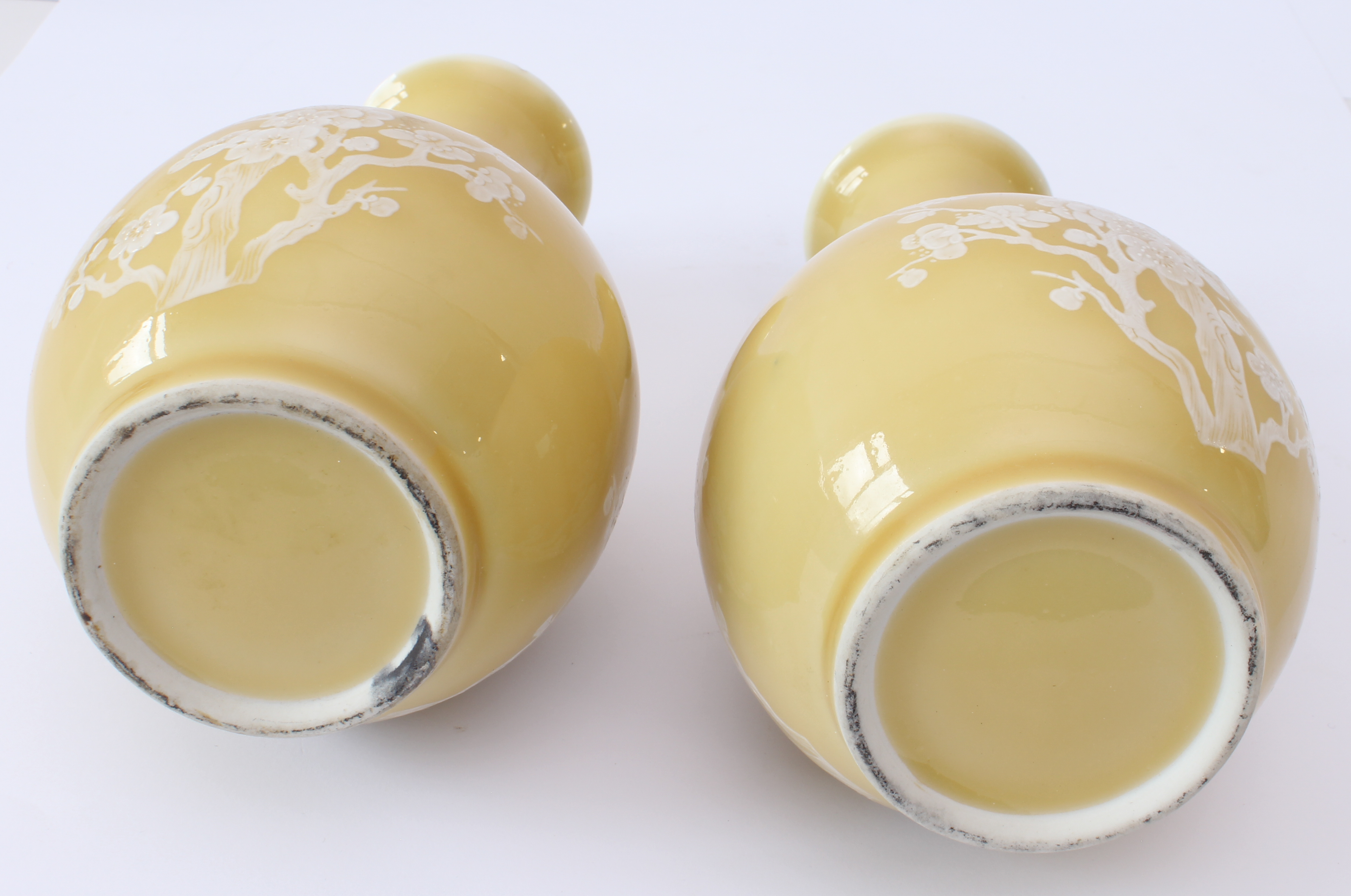 A pair of Chinese porcelain yellow-glazed bottle vases - late 20th century, with white enamelled - Image 3 of 7