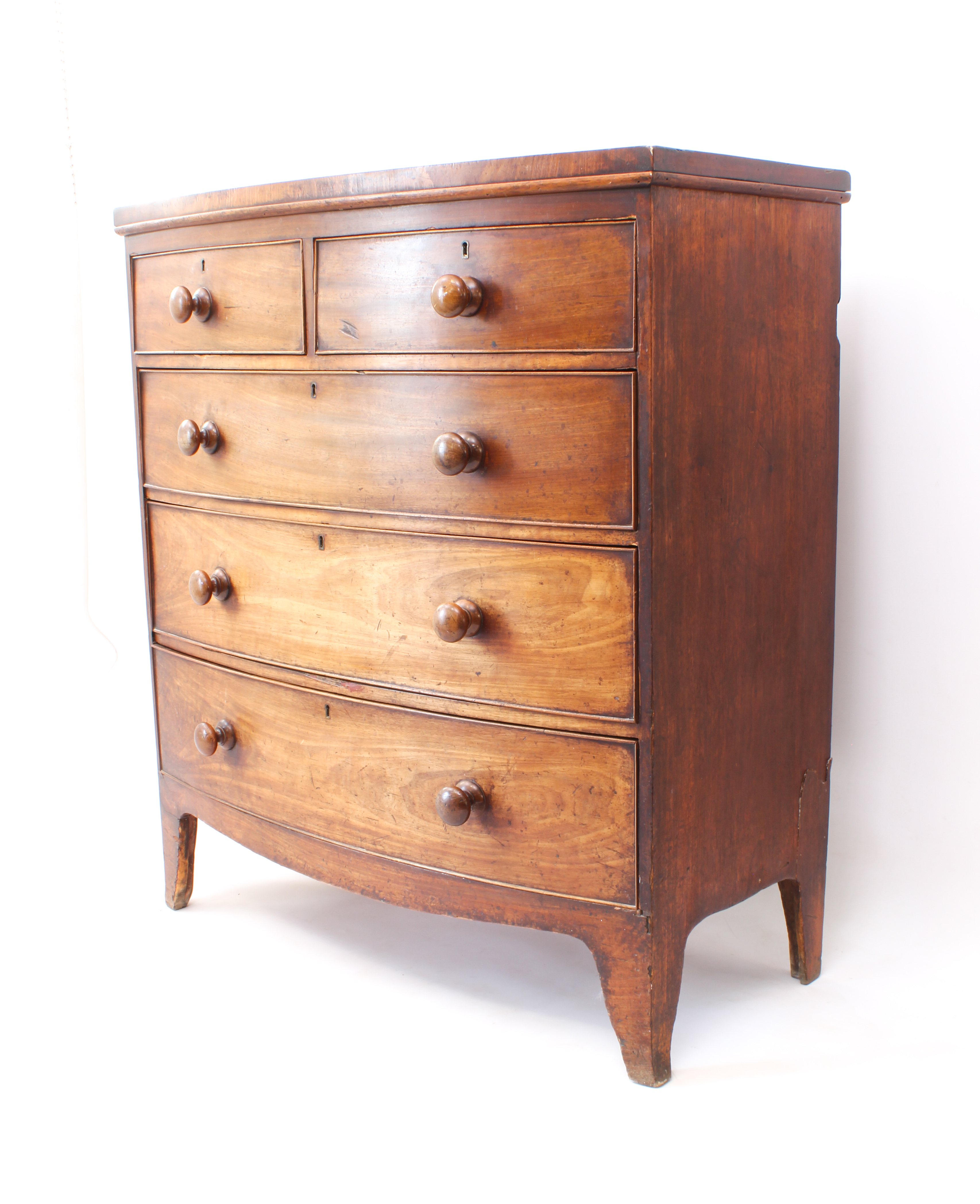 A mid-19th century mahogany bowfront chest of drawers - with two short over three long graduated