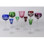 A small collection of coloured wine and liqueur glasses in the style of Val St Lambert -
