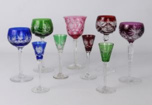 A small collection of coloured wine and liqueur glasses in the style of Val St Lambert -