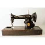 A cased Singer electric sewing-machine (EF305897)